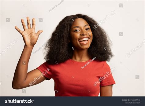 female waving|black woman waving.